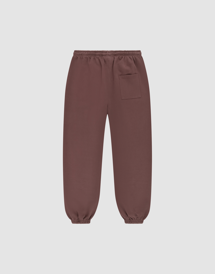 The LIVE FAST DIE YOUNG Wide Cuff Jogger features an elastic waistband, ankle cuffs, and a front right patch pocket, made from soft French Terry and shown against a plain light background.