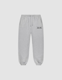Light gray Wide Cuff Jogger sweatpants by LIVE FAST DIE YOUNG with a wide fit, elastic waistband with drawstring, side pockets, and elastic cuffs. Small black script logo on left thigh. Shown on a plain white background. | plain
