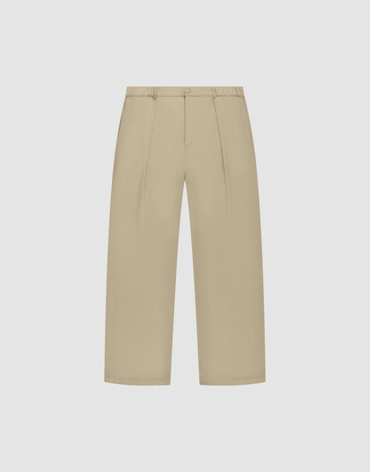 Die Wide Casual Pants von LIVE FAST DIE YOUNG in Beige mit hohem Bund, Frontfalten, Seitentaschen und Knopfverschluss vor weißem Hintergrund. | plain