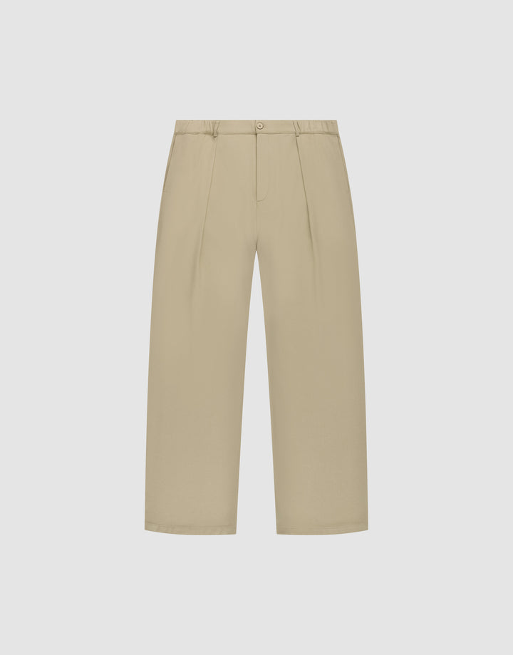 Die Wide Casual Pants von LIVE FAST DIE YOUNG in Beige mit hohem Bund, Frontfalten, Seitentaschen und Knopfverschluss vor weißem Hintergrund. | plain
