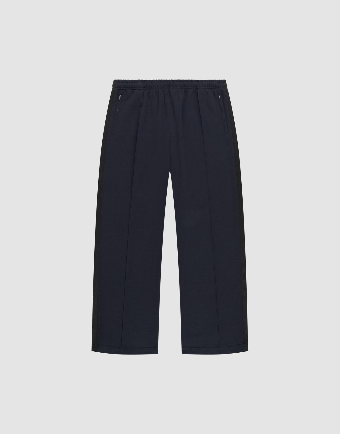 The LFDY Striped Jogger by LIVE FAST DIE YOUNG is a pair of black, wide-leg pants with an elastic waistband and zippered side pockets, featuring subtle Fischgräten-Tape accents, shown on a plain white background.