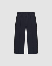 The LFDY Striped Jogger by LIVE FAST DIE YOUNG is a pair of black, wide-leg pants with an elastic waistband and zippered side pockets, featuring subtle Fischgräten-Tape accents, shown on a plain white background. | plain