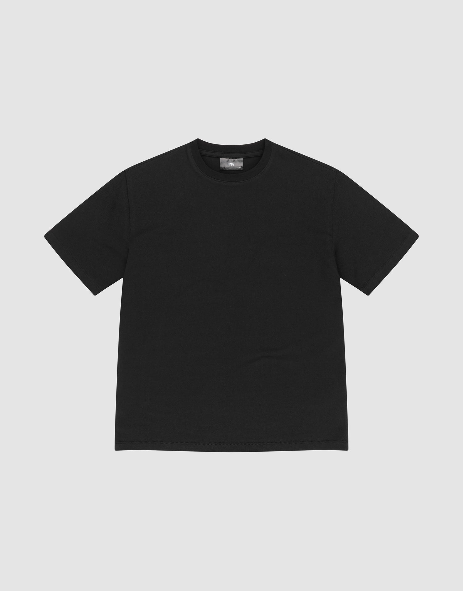 The LFDY Slim Tee by LIVE FAST DIE YOUNG, a plain black slim-fit T-shirt made from soft Baumwolle, is laid flat on a light gray background. | plain