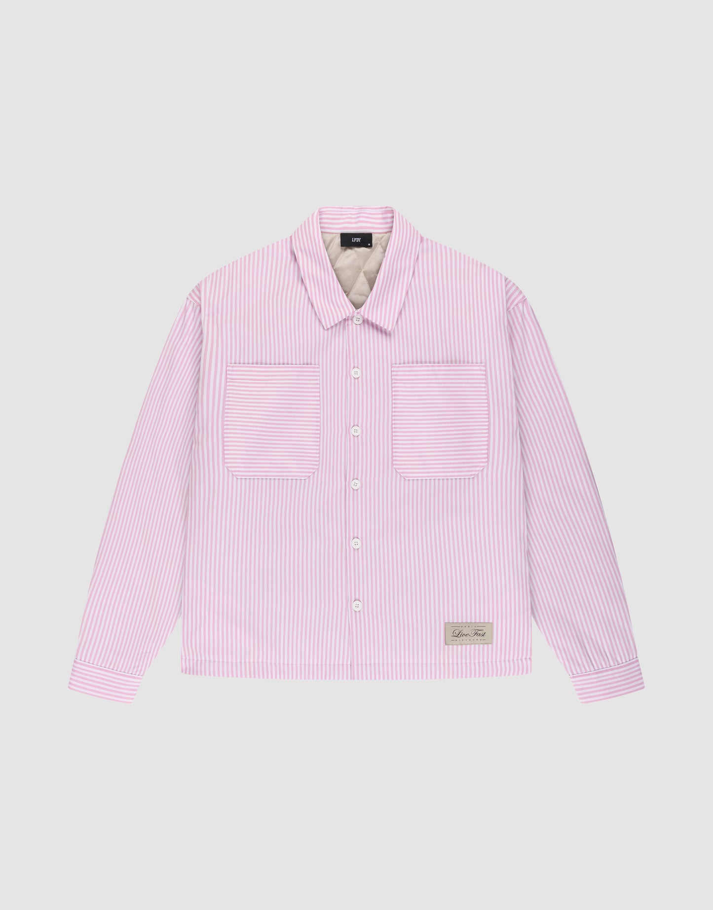 The LFDY Striped Padded Shirt by LIVE FAST DIE YOUNG is a long-sleeve, button-up Herren Hemdjacke with light pink and white vertical stripes, two chest pockets, and a small rectangular patch near the bottom hem.