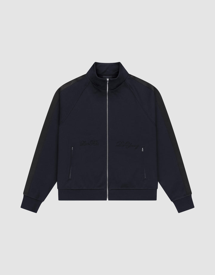 The LFDY Striped Track Jacket by LIVE FAST DIE YOUNG features a navy zip-up design with raglan sleeves, black side stripes, two front zip pockets, and subtle chest embroidery, laid flat on a light gray background. | plain