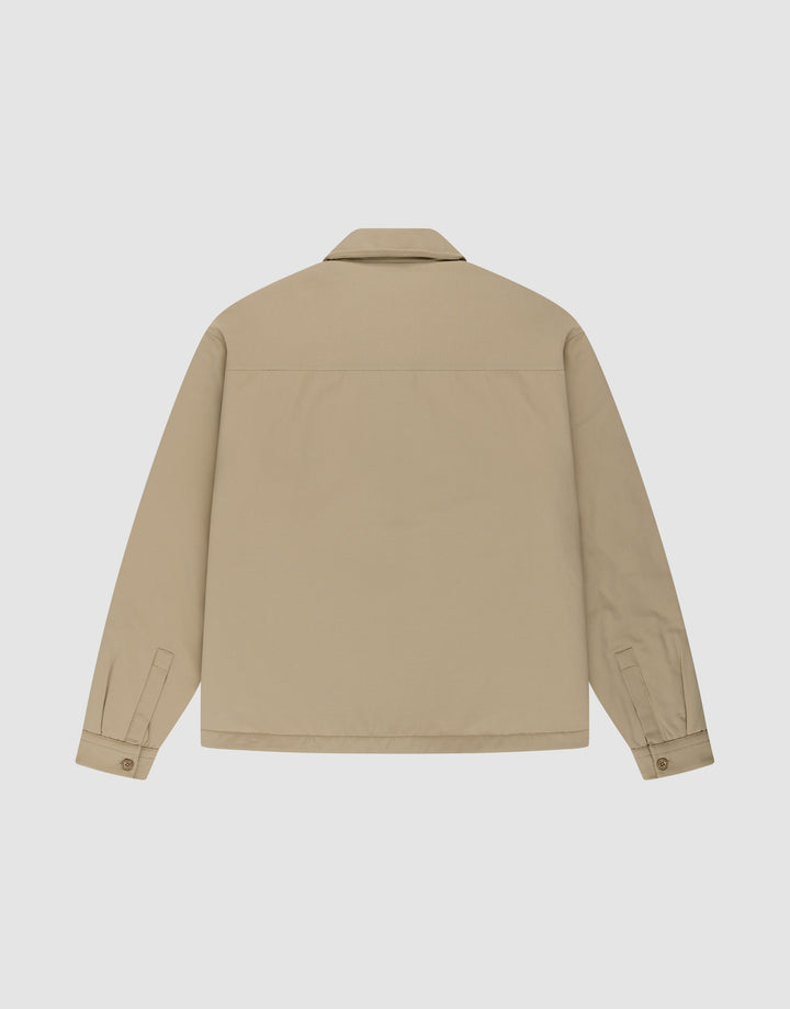 The LFDY Padded Shirt by LIVE FAST DIE YOUNG is a beige, oversized long-sleeve overshirt shown from the back, featuring a straight yoke, pointed collar, buttoned cuffs, and a plain design without visible patterns, logos, or pockets.