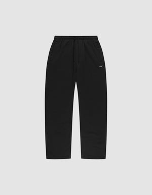 The LIVE FAST DIE YOUNG Basic Wide Jogger features black straight-leg sweatpants with an elastic waistband, drawstring, side pockets, and a small white logo print near the left pocket, shown on a plain light gray background. | plain