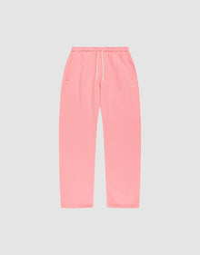The Basic Wide Jogger by LIVE FAST DIE YOUNG features an oversized fit, elastic waistband, white drawstring, and side pockets, shown in pink laid flat on a light gray background. | plain