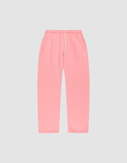 The Basic Wide Jogger by LIVE FAST DIE YOUNG features an oversized fit, elastic waistband, white drawstring, and side pockets, shown in pink laid flat on a light gray background. | plain