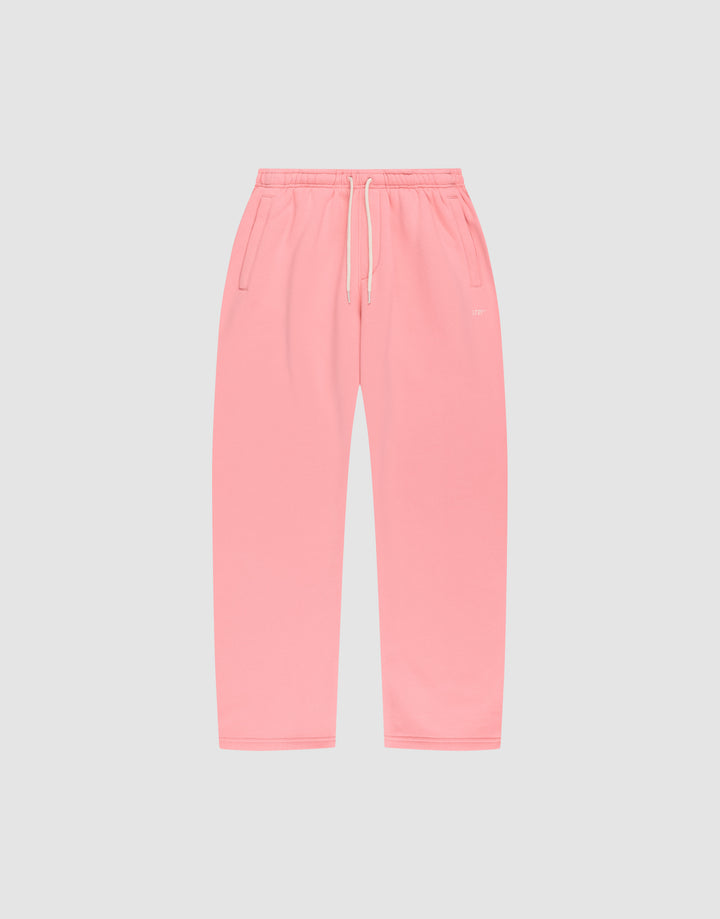 The Basic Wide Jogger by LIVE FAST DIE YOUNG features an oversized fit, elastic waistband, white drawstring, and side pockets, shown in pink laid flat on a light gray background. | plain