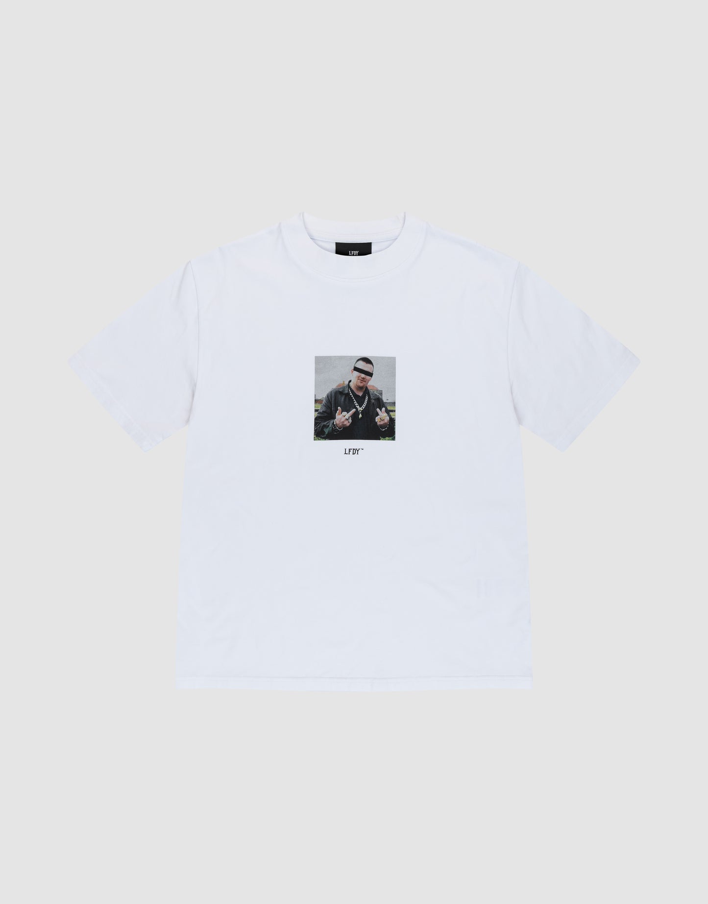 The LFDY Gambling Tee by LIVE FAST DIE YOUNG is a white regular fit t-shirt with a bold front print of a person making hand signs, sunglasses, and beanie. "LITTY" is printed below. Made from 100% Baumwolle. Displayed on a plain light background.