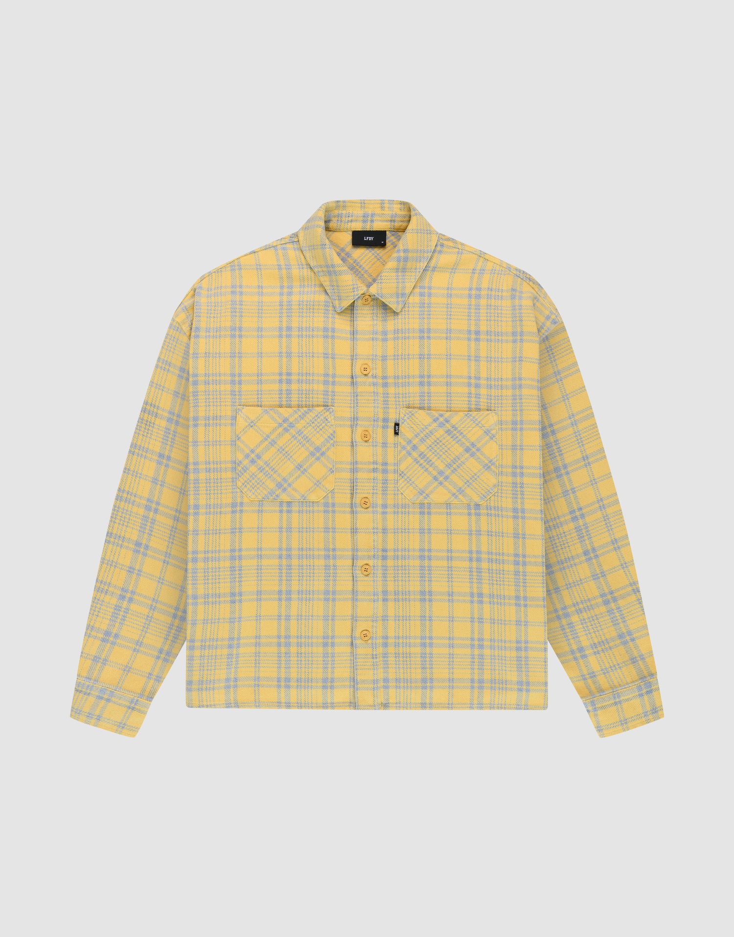 The LIVE FAST DIE YOUNG Vintage Flannel is a yellow and gray plaid oversize long-sleeve button-up shirt with two chest pockets featuring diagonal plaid, a collar, and is shown on a plain white background. | plain
