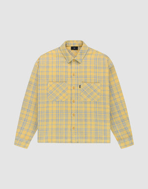 The LIVE FAST DIE YOUNG Vintage Flannel is a yellow and gray plaid oversize long-sleeve button-up shirt with two chest pockets featuring diagonal plaid, a collar, and is shown on a plain white background. | plain