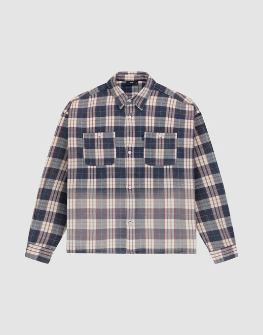 The LIVE FAST DIE YOUNG Vintage Flannel is an oversize, long-sleeve button-up with a Hemdkragen, two chest pockets, and a navy blue, white, and beige striped vintage Waschung pattern. Shirt shown laid flat on a light background. | plain