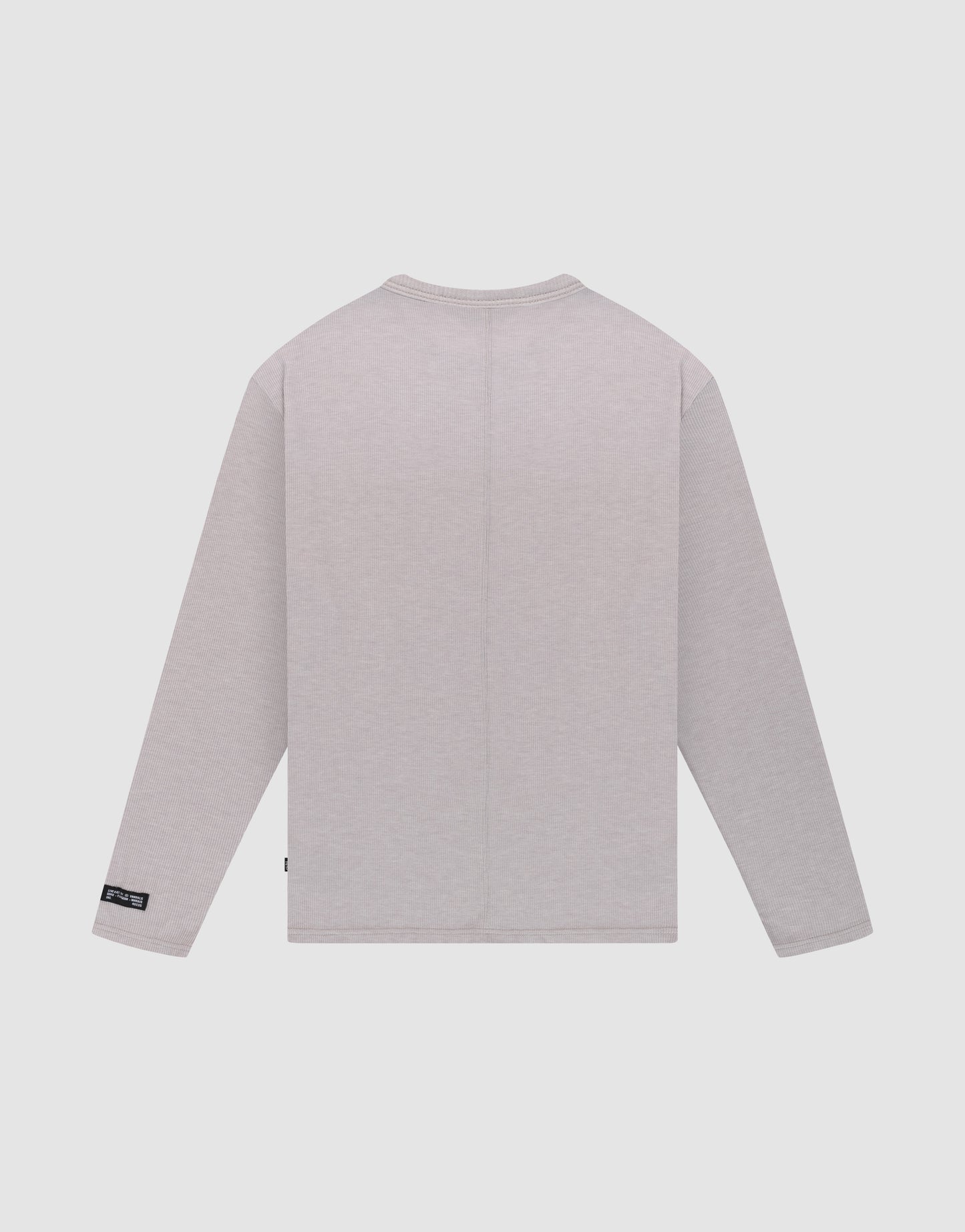 The LFDY Rib Longsleeve by LIVE FAST DIE YOUNG is shown in plain light gray, oversize fit, viewed from the back against a white background. It features no visible designs except a small black tag on the lower left side seam.