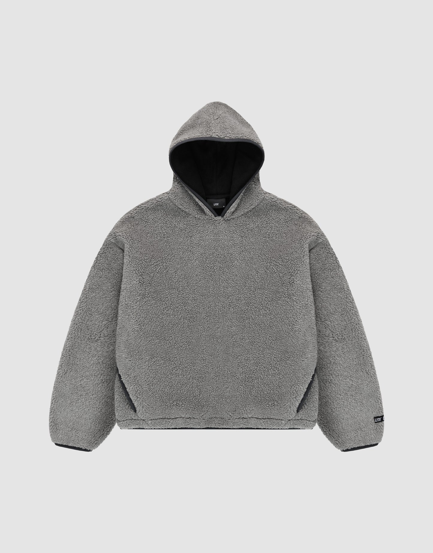The LFDY Teddy Hooded by LIVE FAST DIE YOUNG is a gray, long-sleeve, oversized hoodie with soft fleece-like material and practical pockets, shown flat on a light gray background.