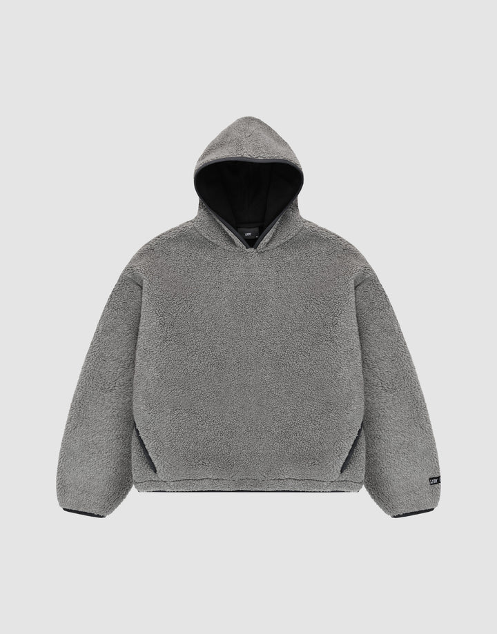 The LFDY Teddy Hooded by LIVE FAST DIE YOUNG is a gray, long-sleeve, oversized hoodie with soft fleece-like material and practical pockets, shown flat on a light gray background. | plain