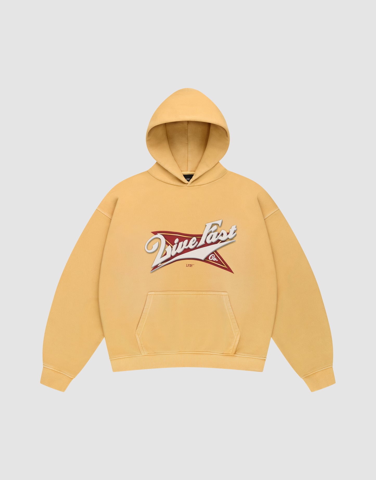The LFDY Corp. Hooded by LIVE FAST DIE YOUNG is a yellow oversized hoodie with a front pocket and a bold “Drive Fast” graphic over a red and white star on the chest.