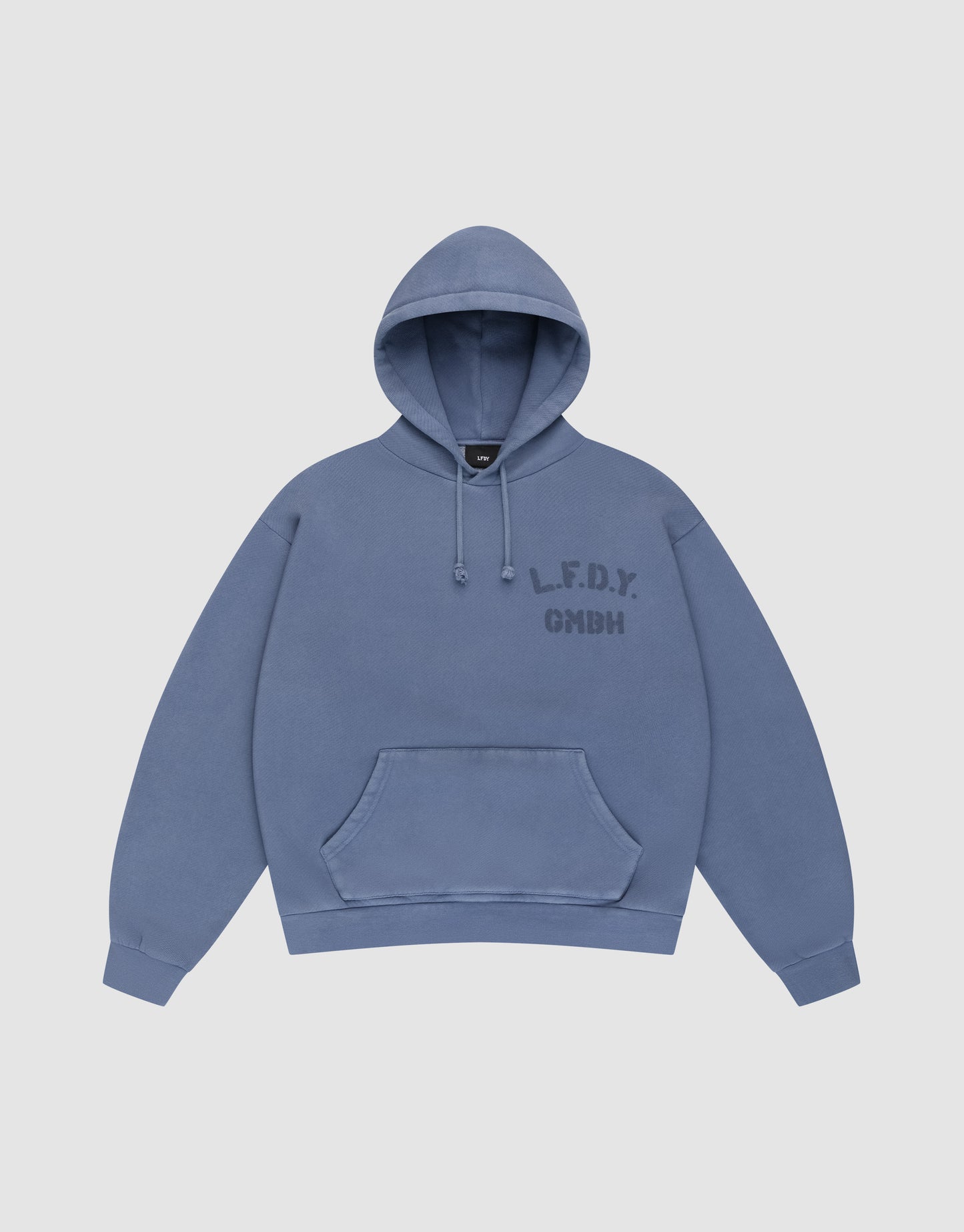 A blue LFDY GmbH Hooded hoodie by LIVE FAST DIE YOUNG with an oversize fit, drawstring hood, front pocket, and “L.F.D.Y. GMBH” in dark blue on the left chest. Displayed flat on a plain light background for a clean look.