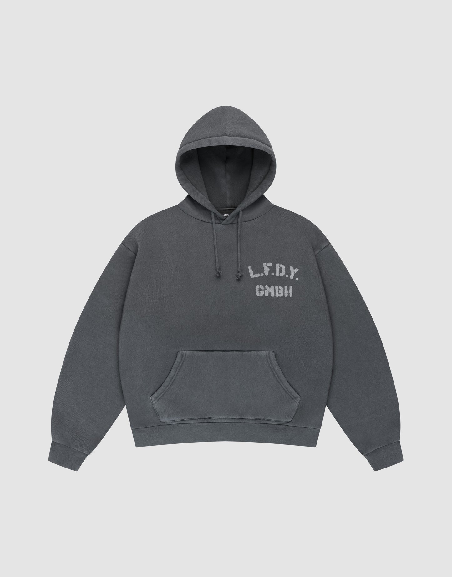 The LIVE FAST DIE YOUNG LFDY GmbH Hooded is a dark gray oversize-fit hoodie with drawstring hood and front pocket, featuring white "L.F.D.Y. GMBH" print on the left chest and subtle vintage wash, shown flat on a light gray background.