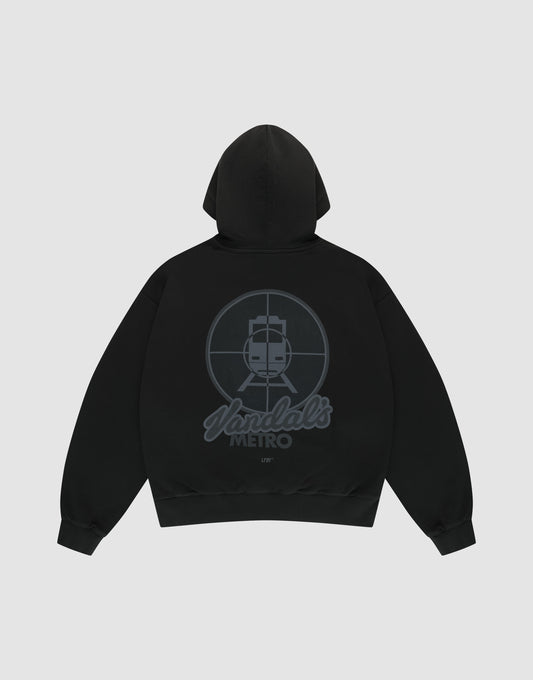 The LFDY Vandals Hooded by LIVE FAST DIE YOUNG is a black oversized hoodie with a large back graphic of a stylized train in a crosshair circle and "Yardals METRO" text, all in dark gray. Made from 100% Baumwolle, shown flat on a light background. | plain