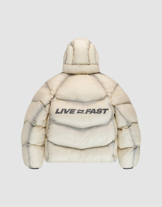 The cream-colored Live Fast Puffer Jacket by LIVE FAST DIE YOUNG features a hood, oversize fit, and bold "LIVE FAST" print across the upper back. Reflective front and back prints add modern style. Shown from the back.