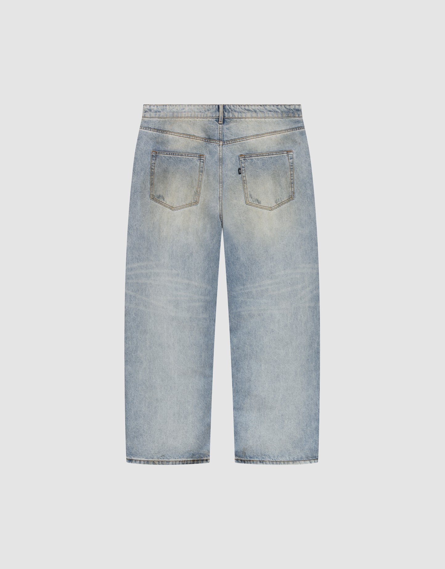 Back view of the LFDY Baggy Dirt Denim by LIVE FAST DIE YOUNG in light blue 100% cotton, featuring a faded wash, two back pockets, relaxed straight legs, and subtle horizontal distressed lines for a casual look.