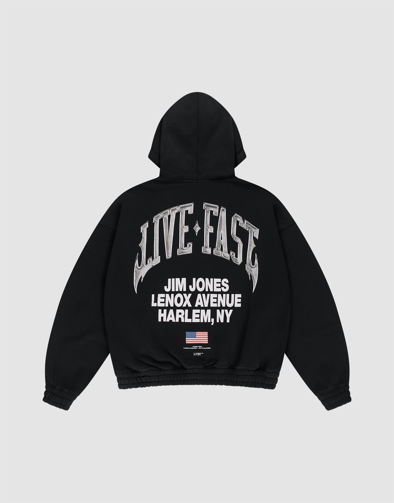 The Live Fast Lenox Hooded Zip by LIVE FAST DIE YOUNG is a black oversized zip hoodie featuring metallic "LIVE FAST" on the back, "JIM JONES LENOX AVENUE HARLEM, NY" prints front and back, plus a small American flag below.