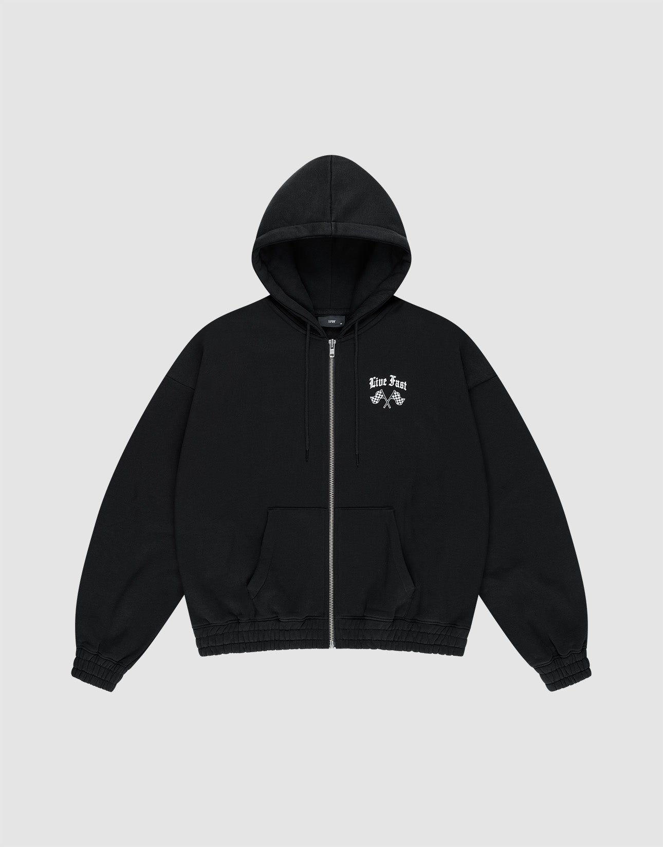 The LFDY Haters Hooded Zip by LIVE FAST DIE YOUNG is a black oversize-fit zip-up hoodie with a front pocket, doppellagige Kapuze, and small white graphic and text on the left chest, shown on a plain light gray background.