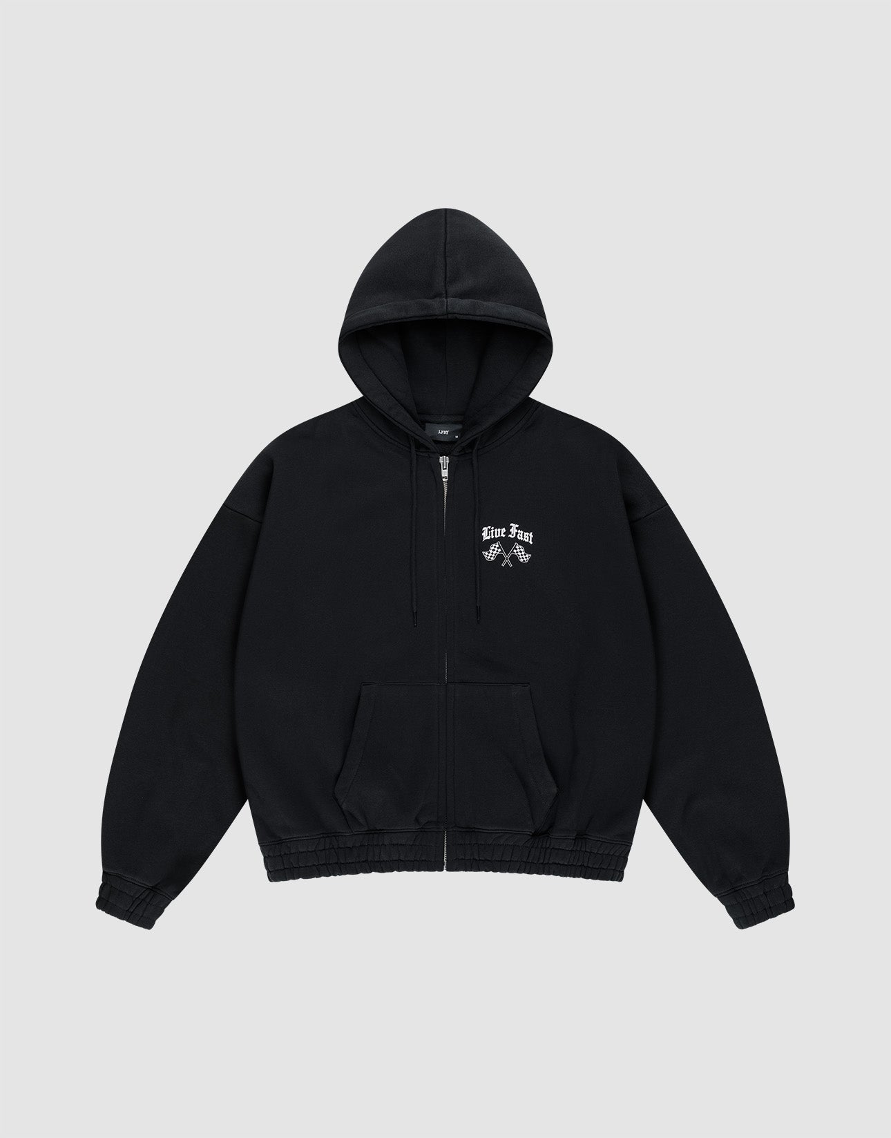 The Ride or Die Hooded Zip by LIVE FAST DIE YOUNG is a black zip-up hoodie with front pockets and doppellagige Kapuze, a small white "Live Free" graphic above two crossed hands on the left chest, and an oversize fit. Shown on light gray background.