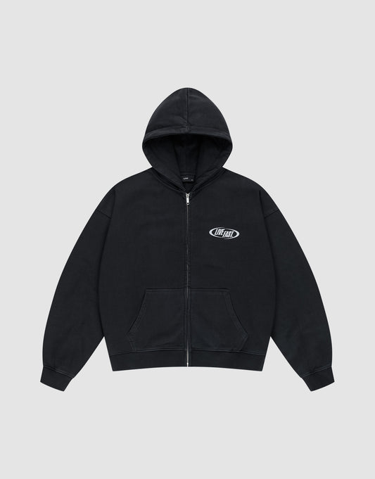 The LIVE FAST DIE YOUNG LFDY Canine Hooded Zip is a black oversized zip-up hoodie with a front pocket, small white OhFast logo on the left chest, and silver print, shown on a light gray background.