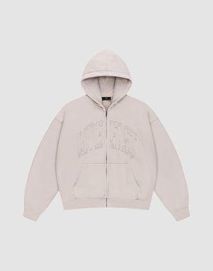 The Ripped College Hooded Zip by LIVE FAST DIE YOUNG is a beige oversized zip-up hoodie with a hood, front pockets, and large distressed "LIVE FAST" embroidery on the chest, shown against a plain white background.| plain
