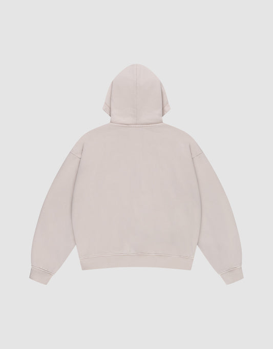 The LIVE FAST DIE YOUNG Ripped College Hooded Zip in Oversize Fit is shown flat from the back, featuring long sleeves, a hood, and ribbed cuffs and hem. Made from 100% Baumwolle for comfort. Color: plain light beige.