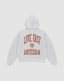 The Live Fast Amsterdam Hooded by LIVE FAST DIE YOUNG is a light gray oversized sweatshirt in 100% cotton, featuring bold red and gold "LIVE FAST" lettering and emblem on the back, plus AMSTERDAM. Front and back prints make it stand out. | plain