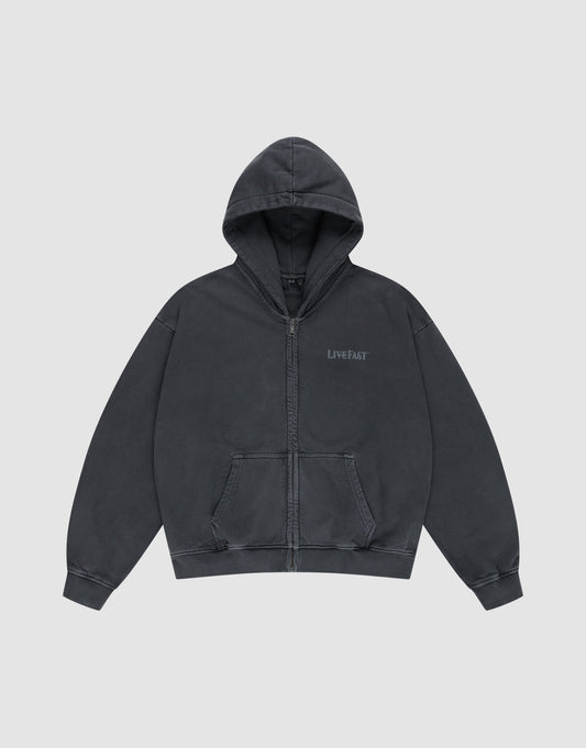The LFDY Loyal Hooded Zip by LIVE FAST DIE YOUNG is a dark gray, oversized zip-up hoodie with a front pocket, "LIVE FAST" on the left chest, made from 100% Baumwolle with vintage Waschung, shown laid flat on a light gray background.