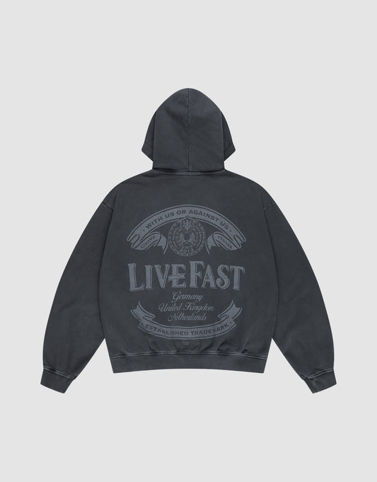 The LFDY Loyal Hooded Zip by LIVE FAST DIE YOUNG is a dark gray oversized hoodie with a large back graphic—two eagle heads, circular emblem, "LIVE FAST" text, and vintage banners. Made from 100% Baumwolle with cool vintage wash. | plain