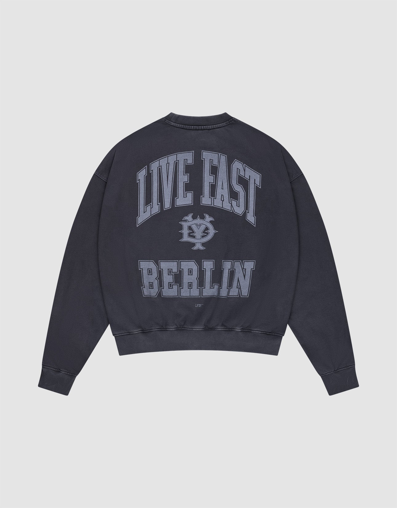 The Live Fast Berlin Sweater by LIVE FAST DIE YOUNG is an oversized dark navy sweatshirt made from 100% cotton, with large light blue "LIVE FAST" and "BERLIN" text plus a stylized logo on the back. | plain