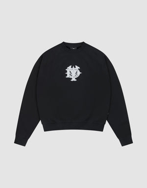 The DY Sweater by LIVE FAST DIE YOUNG is a black crewneck with raglan sleeves and a white abstract chest graphic, made from 100% cotton. Shown on a plain light gray background. | plain
