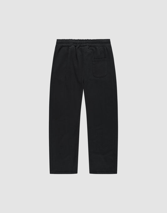 The Basic Wide Jogger by LIVE FAST DIE YOUNG features an elastic waistband, straight wide-fit legs, and a single back patch pocket, made from soft cotton and shown against a plain white background.