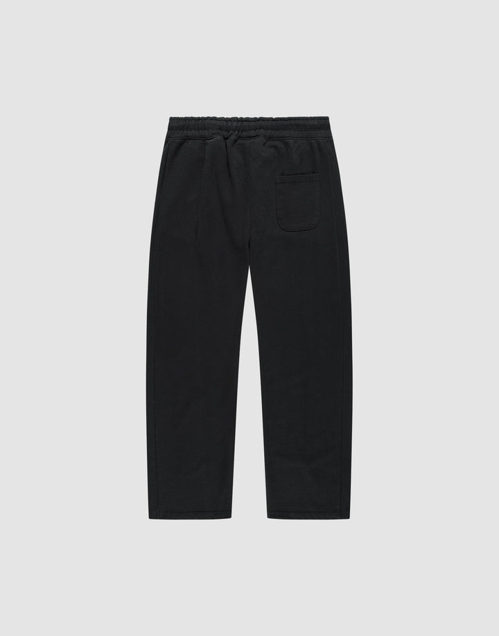 The Basic Wide Jogger by LIVE FAST DIE YOUNG features an elastic waistband, straight wide-fit legs, and a single back patch pocket, made from soft cotton and shown against a plain white background.