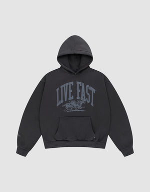 The LIVE FAST DIE YOUNG Live Fast Stallion Hooded is a black oversized cotton sweatshirt with a gray "LIVE FAST" print and running animal design on the front, shown on a plain light gray background. | plain