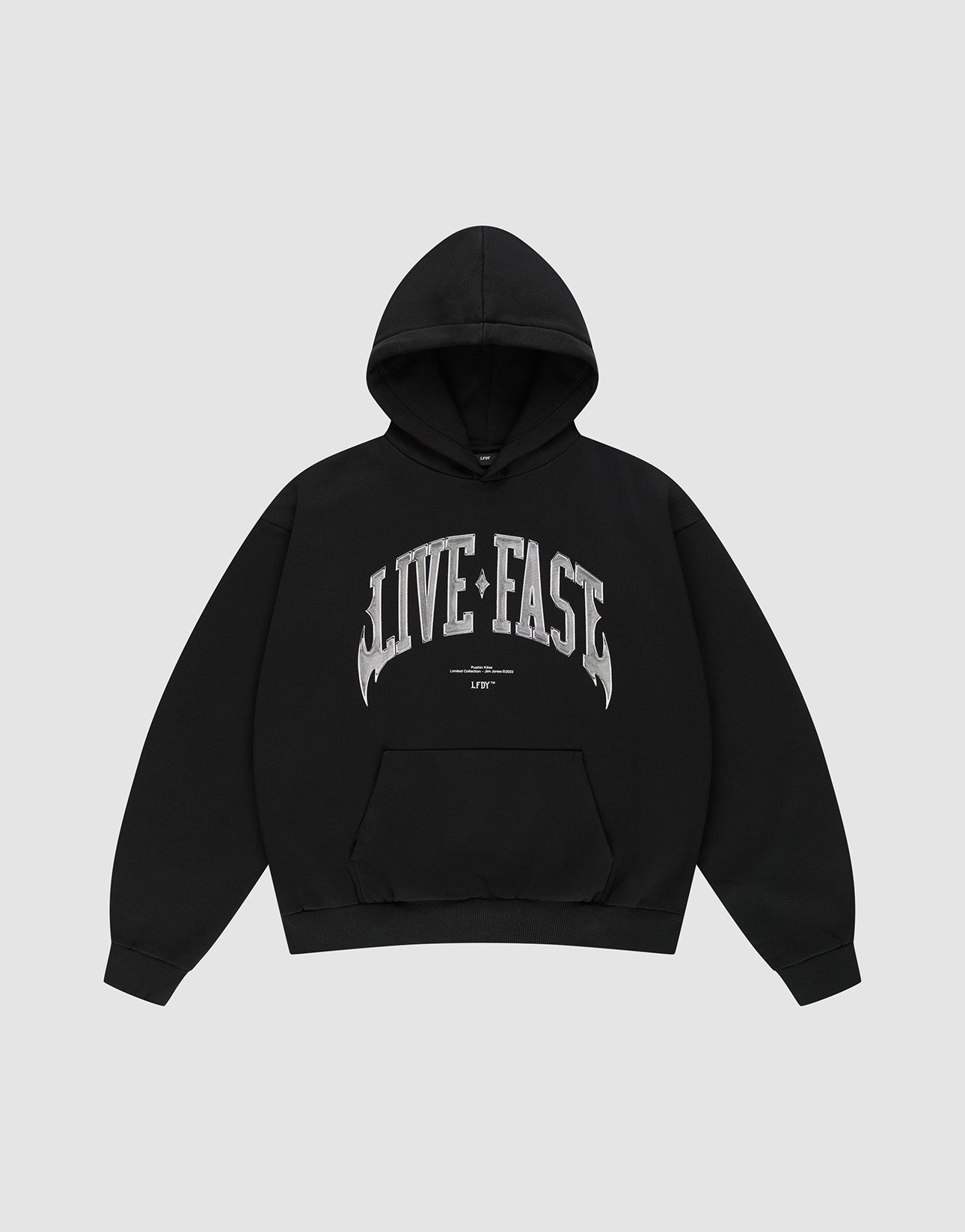 The Live Fast Axe Hooded by LIVE FAST DIE YOUNG is an oversized black hoodie with a front pocket and bold silver "LIVE FAST" front print, made from soft cotton and shown laid flat on a light gray background.