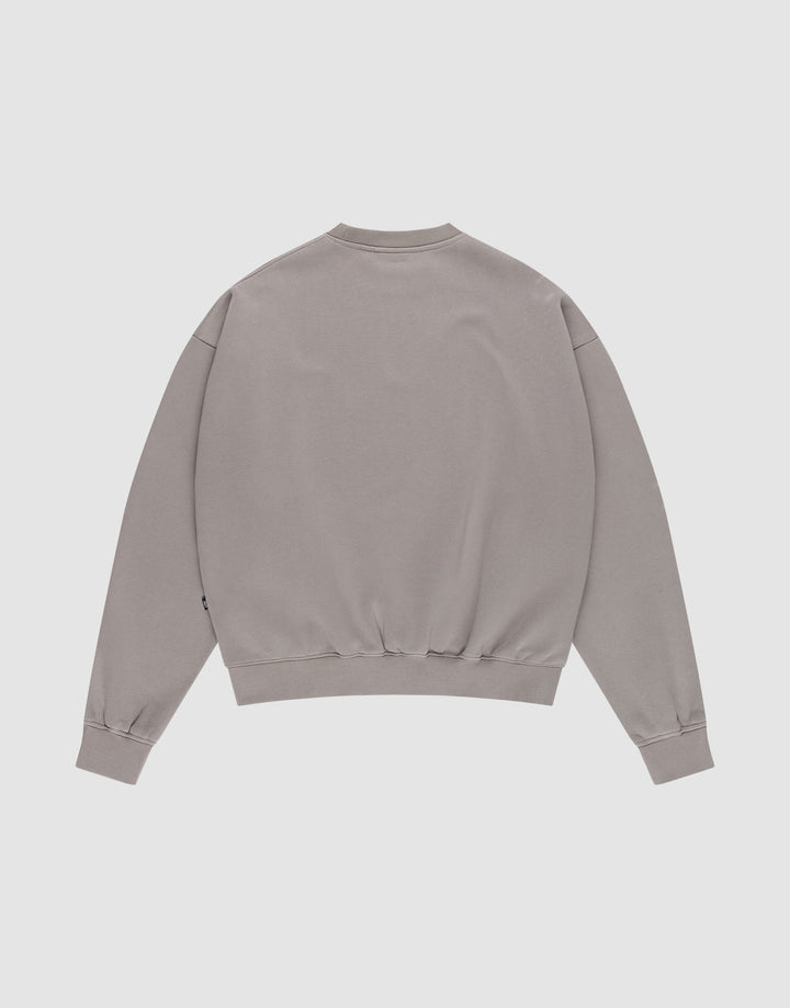 The LIVE FAST DIE YOUNG Basic Blank Sweater is a light gray, oversized, long-sleeve sweatshirt with ribbed cuffs, collar, and waistband, shown laid flat with the back facing up on a white background.