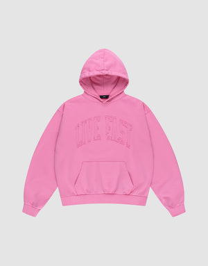The Ripped College Hooded by LIVE FAST DIE YOUNG is a bright pink oversized hoodie made from 100% Baumwolle, featuring a front pocket and bold "LIVE FAST" lettering across the chest, shown laid flat on a plain light background. | plain