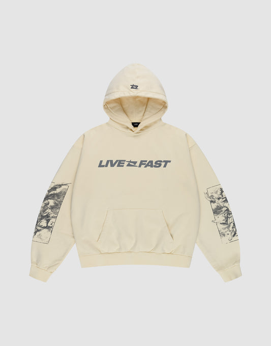 The LFDY Window Hooded by LIVE FAST DIE YOUNG is an oversized beige hoodie in 100% cotton, featuring "LIVE FAST" text with a small graphic, black reflective prints on both sleeves, a logo on the hood, and a front pocket.