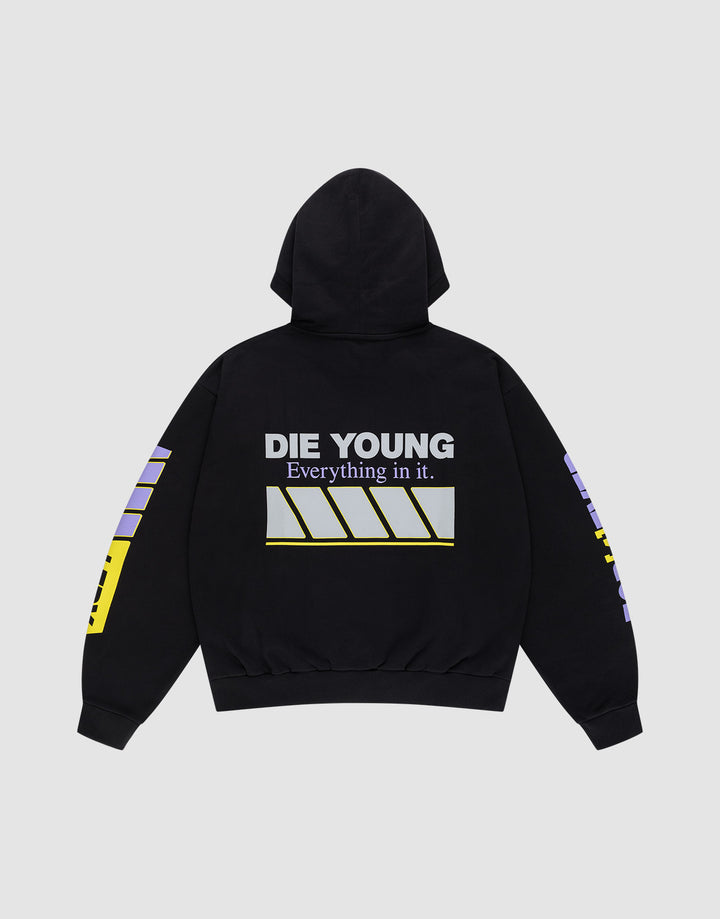 The LFDY Racing Hooded by LIVE FAST DIE YOUNG is an oversized black hoodie with DIE YOUNG and Everything in it. in glossy print above diagonal white and yellow stripes on the back, plus bold yellow and purple geometric designs on both sleeves.