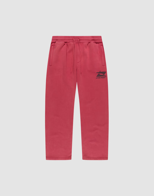 The Live Fast Sweatsuit Jogger from LIVE FAST DIE YOUNG features a wide fit, elastic waistband with drawstring, side pockets, and a small black “LONELY” logo on the left thigh, shown against a plain light background. | plain
