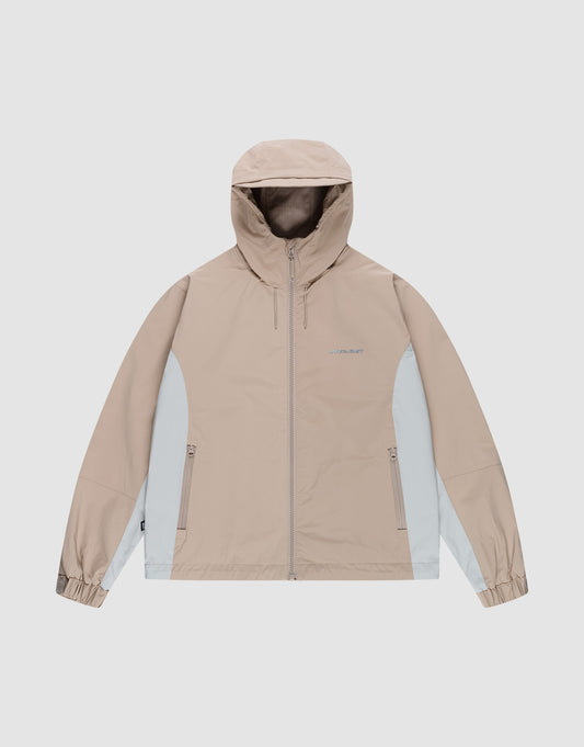 The Basic Shell Jacket by LIVE FAST DIE YOUNG in beige and light gray features an oversize fit, hood, front zipper, two zippered side pockets, and elastic cuffs. Shown on a plain light gray background. | plain