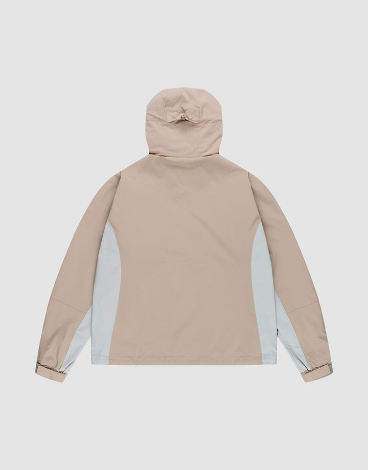 The LIVE FAST DIE YOUNG Basic Shell Jacket features a beige color, light gray side panels, long sleeves, and an Oversize Fit. Shown from the back against a plain white background.