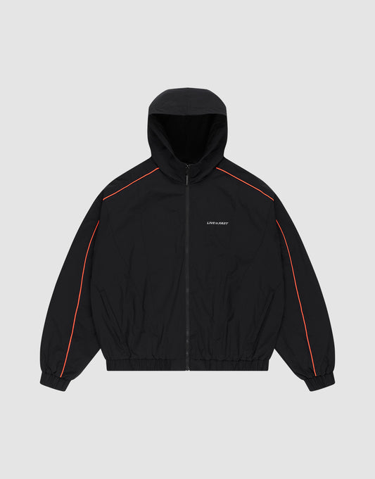 The Live Fast Trackjacket by LIVE FAST DIE YOUNG is a black zip-up hoodie with red piping on the shoulders and sleeves, elastic cuffs and hem, zippered side pockets, and small white LIFE SUX ART text on the left chest, shown on a light gray background. | plain
